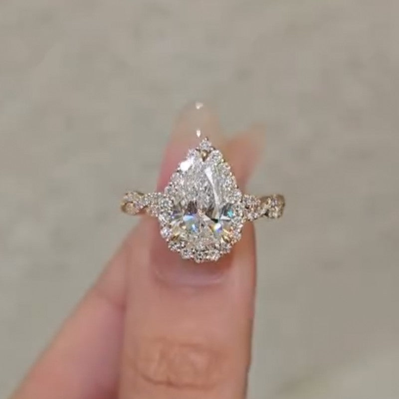 ER1632YS-3-1756206690 S925 4.0Ct Pear Cut Twist Halo Engagement Ring In Sterling Silver - Image 1