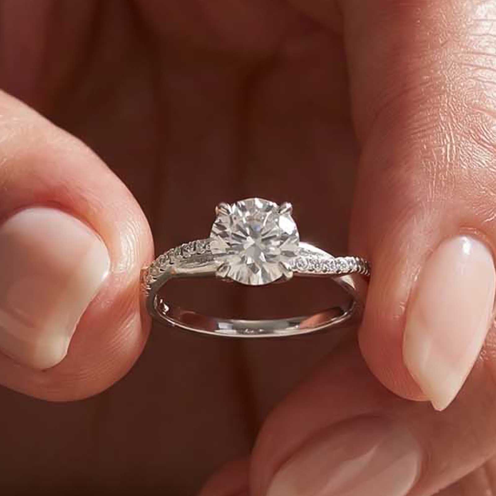 ER1866PMSS-2-SfQLK1 S925 Moissanite Twist White Gold 1.0Ct Round Cut Engagement Ring in Sterling Silver - Image 1